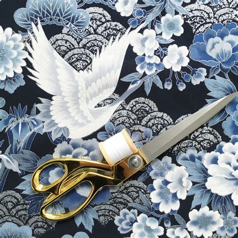 japanese white cranes on medium blue fabric metallic plants|Japanese crane fabric (blue/silver) – Vintage High Street.